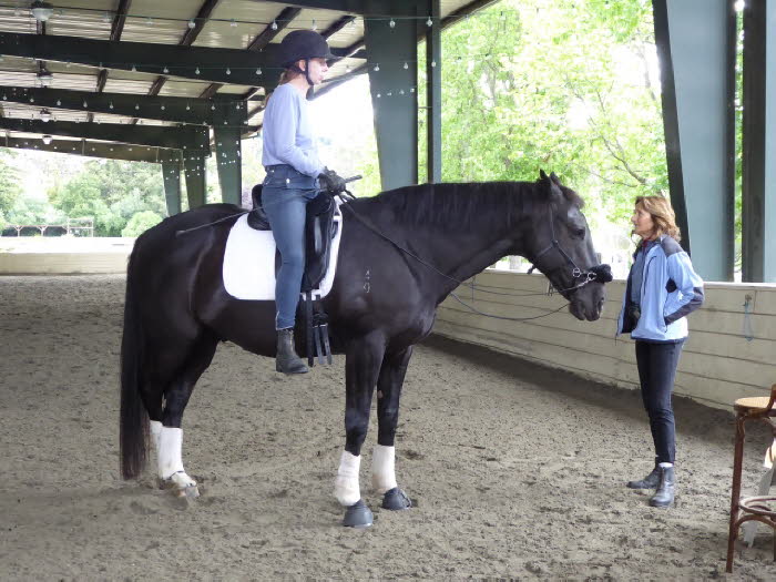 Pre-ride consultation for Jennifer and Mana